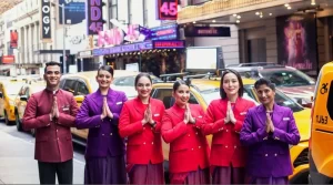 crew members in front of iconic yellow cabs in new york